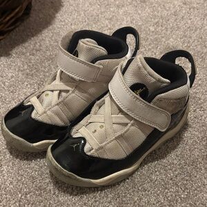 Kids Jordan White and Black Sneakers